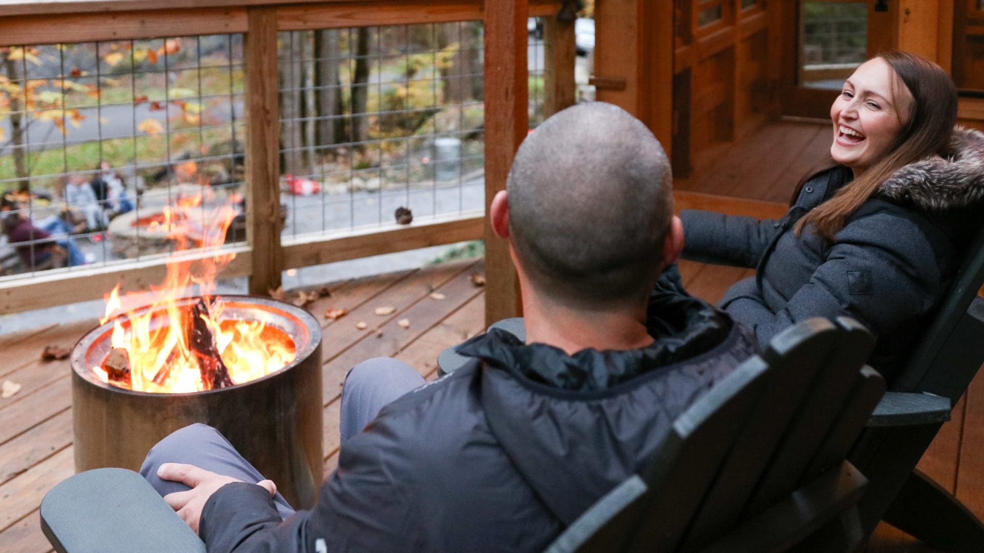 Couple Gathered Around a Fire